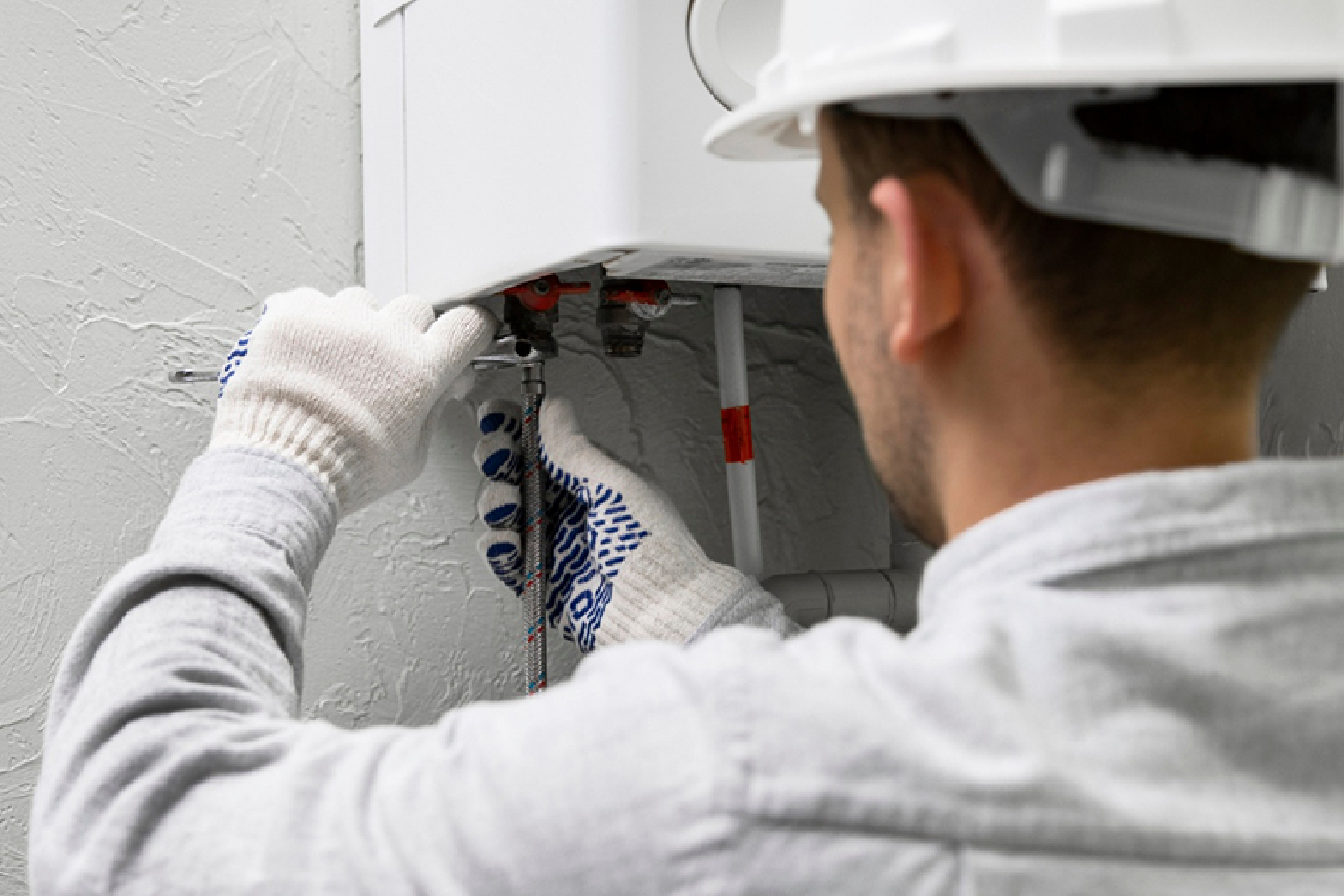 worker repairing water heater